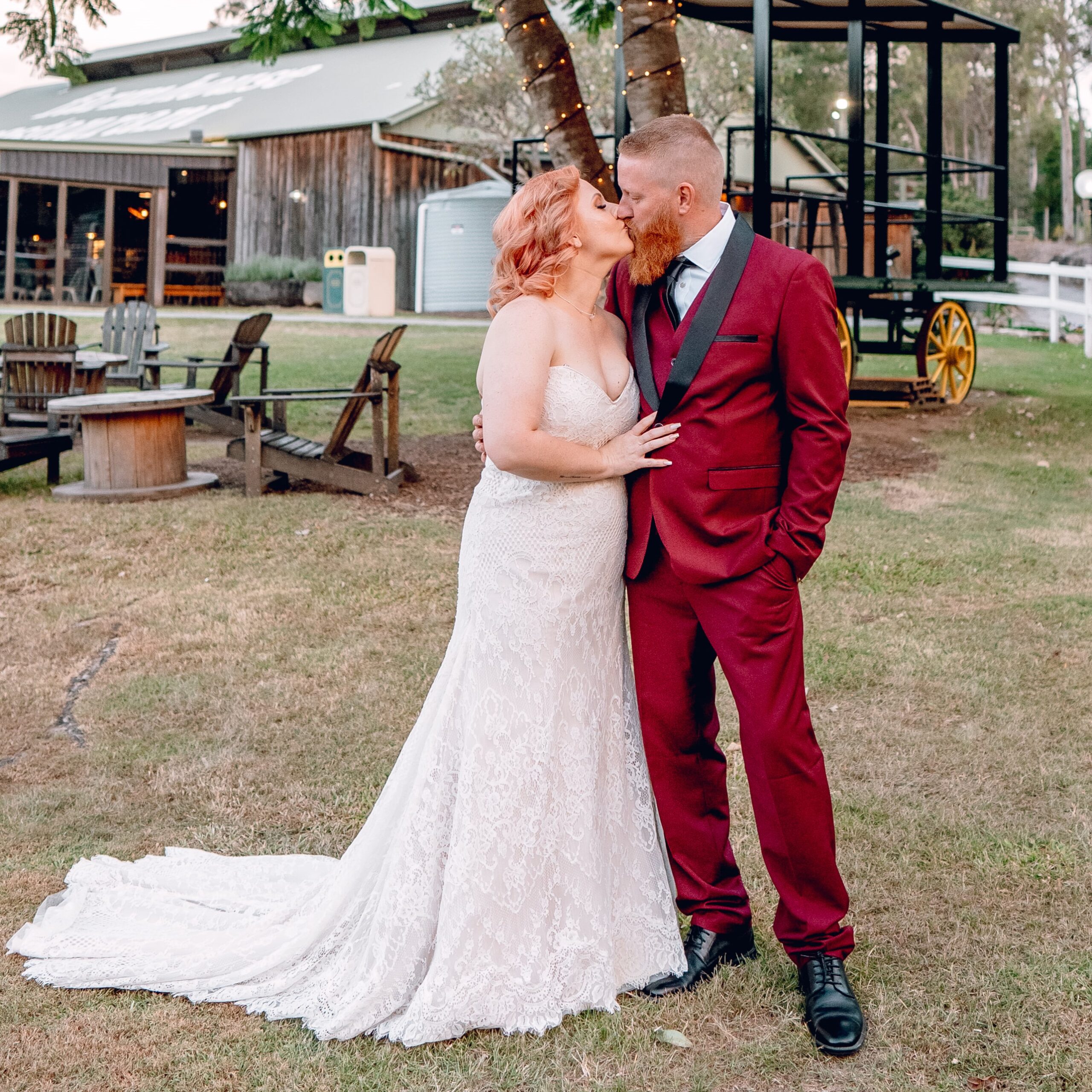 Bride and groom at a rustic wedding venue with bridal hair and makeup