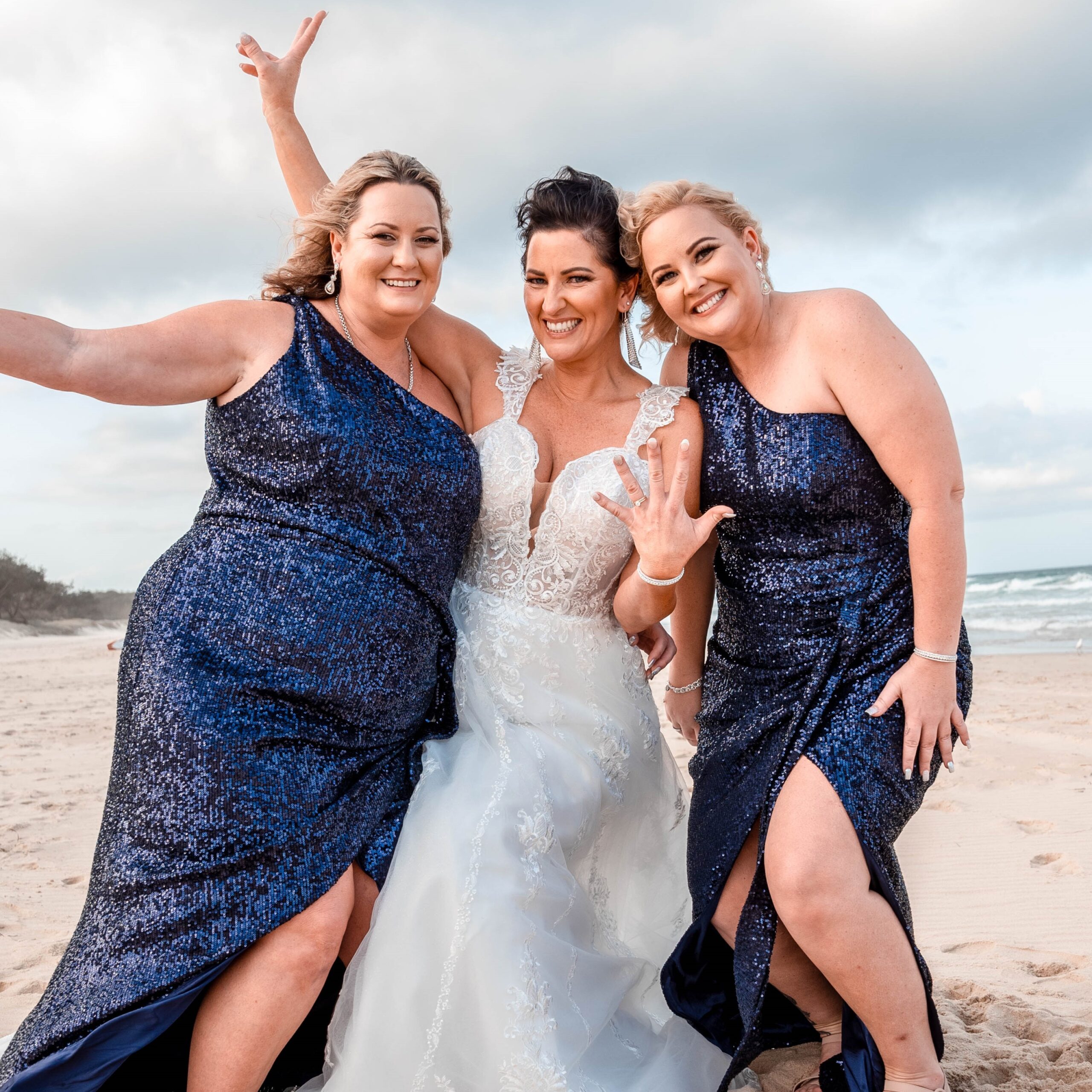 Bridal party on the beach with hair and makeup by Lou Lou Belles